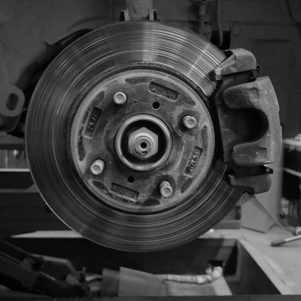 Brake disc and calliper on a car up on the lift