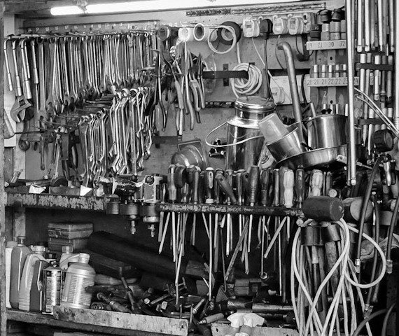 A wall of spanners and screwdrivers sorted by size