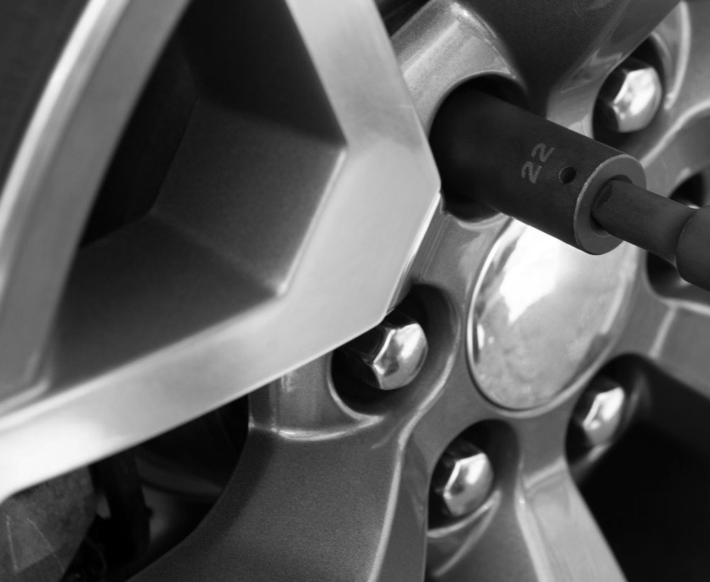 Impact wrench on a wheel’s nuts before it comes off
